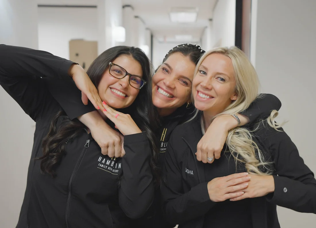 Three smiling members of the Hamblin dental team